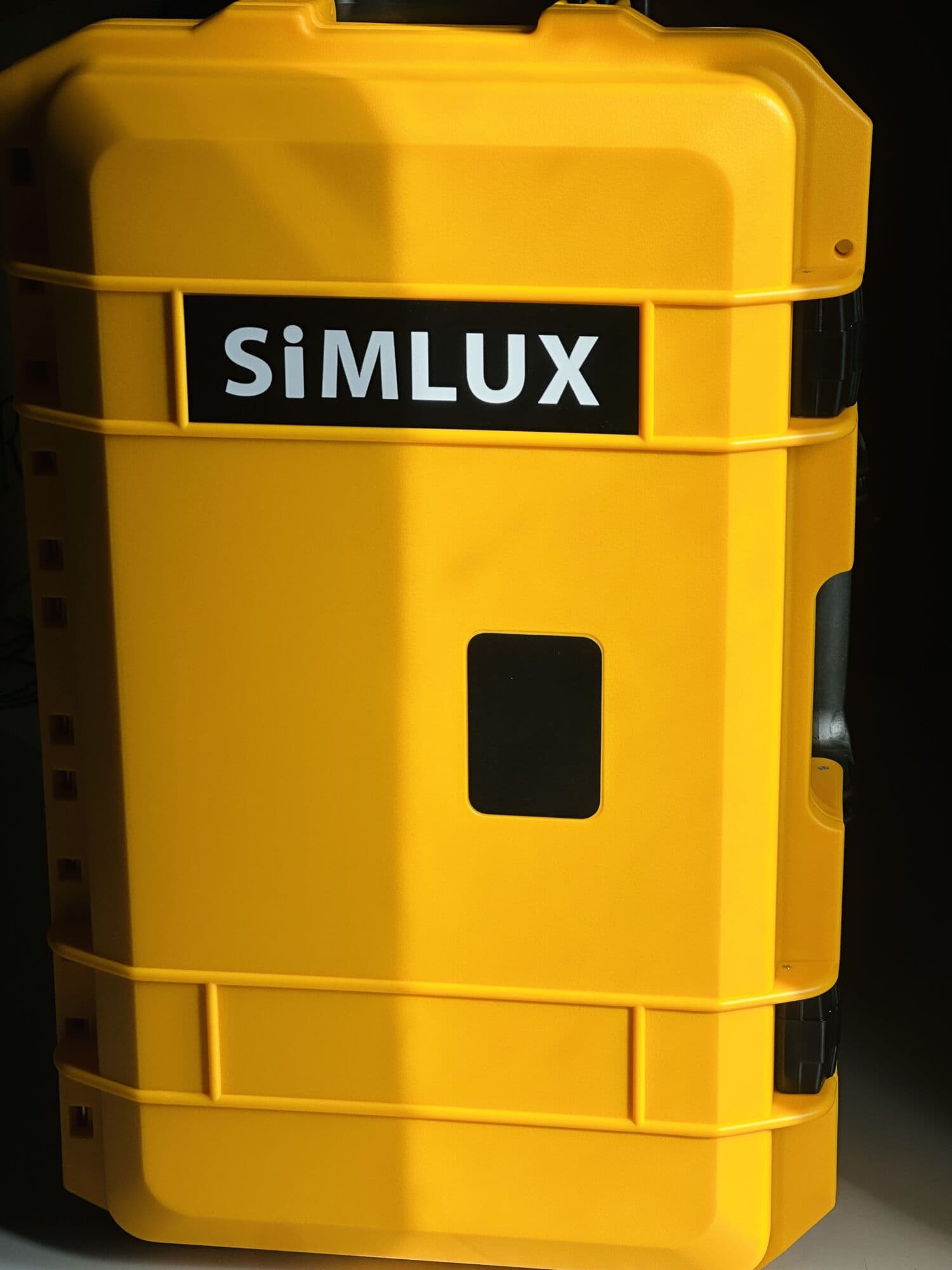 Yellow case with the SiMLUX badge